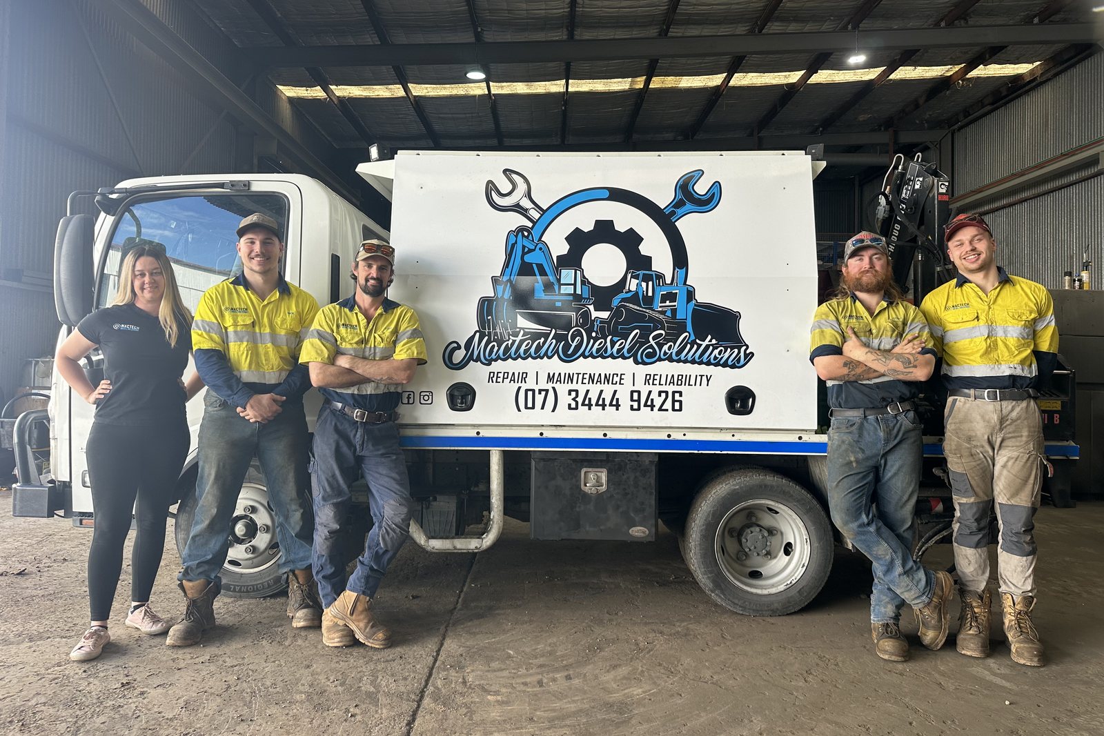 The Mactech Diesel Solutions team standing in front of their branded field service truck at the Rocklea workshop